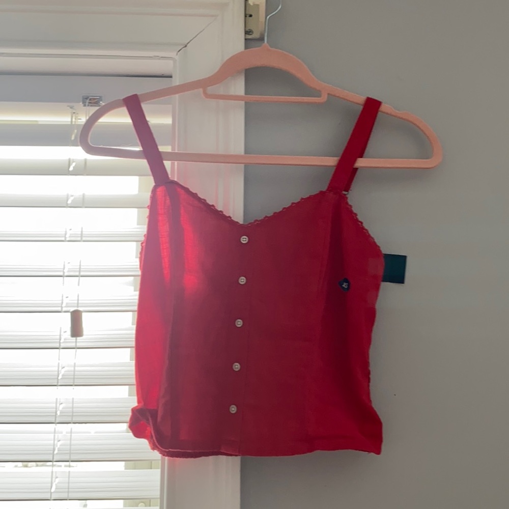Red crop top with button decoration. Never worn